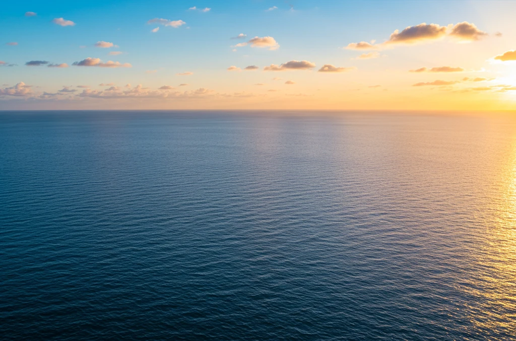 Calm open sea at sunset, viewed from the water