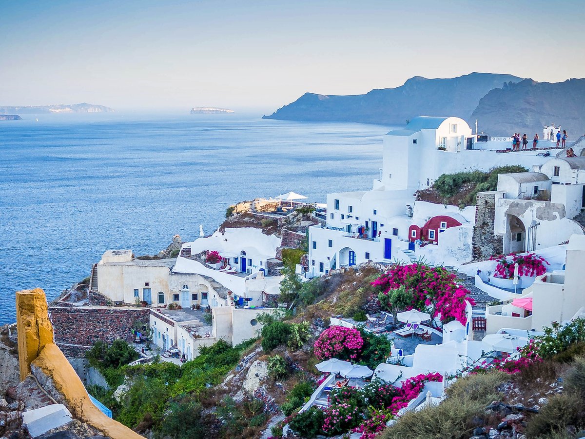 Whitewashed buildings above the caldera in Santorini, Greece